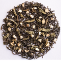 A circular arrangement of loose-leaf herbal tea blend on a plain white background, showing dark tea leaves mixed with pale dried flowers and small light beige chunks.