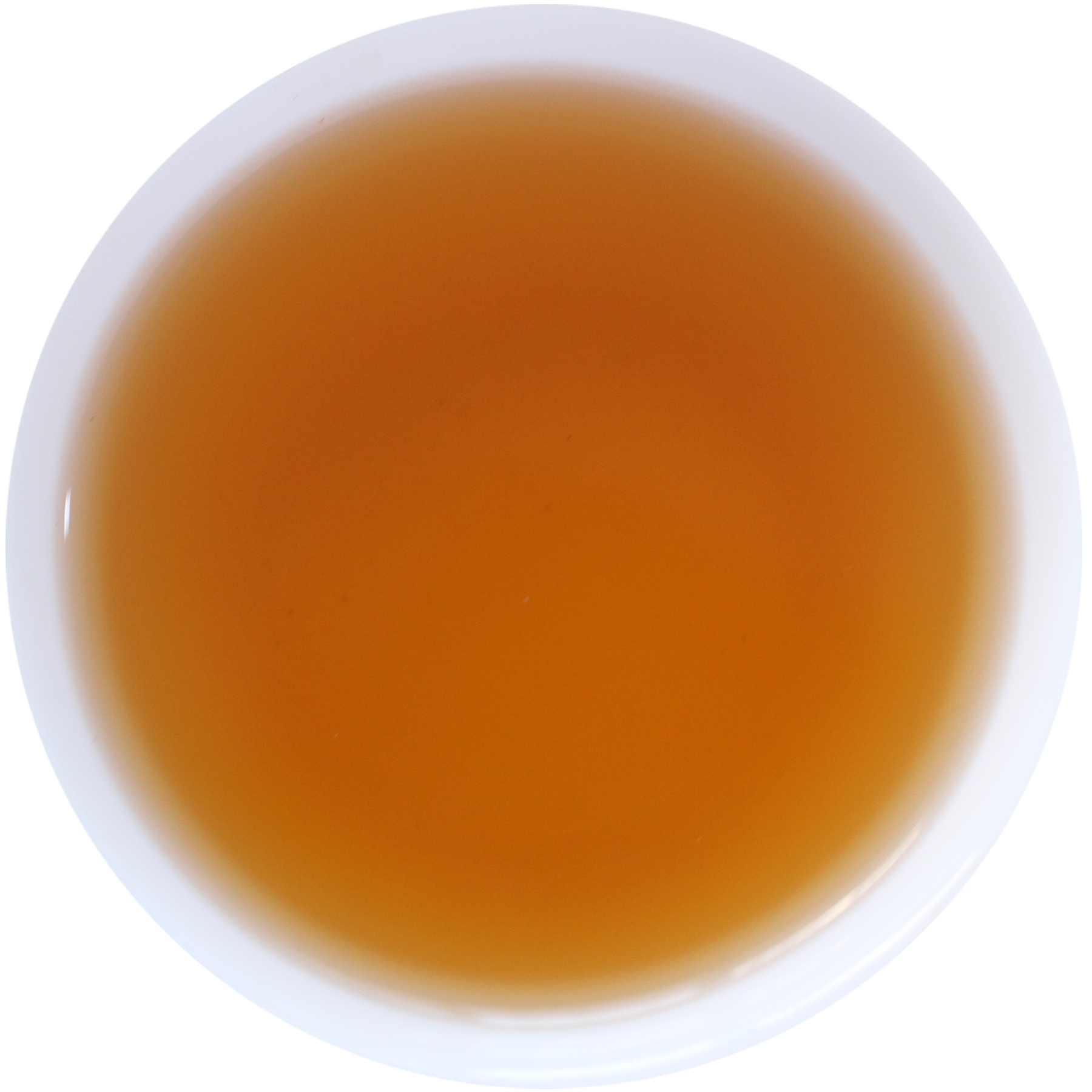 A top-down view of a white cup filled with a warm amber-brown liquid, likely tea or coffee, against a plain white background.