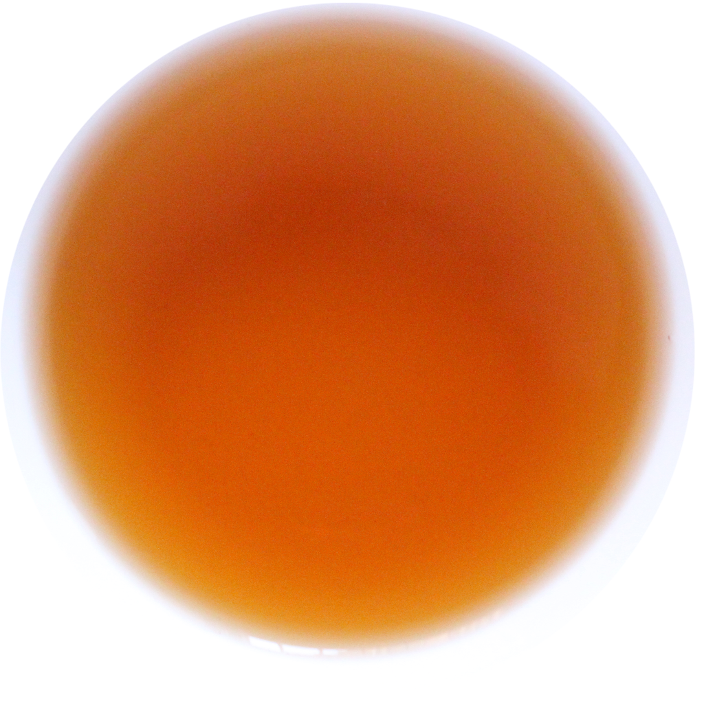 A circular color swatch showing a warm amber-orange translucent hue on a white background.