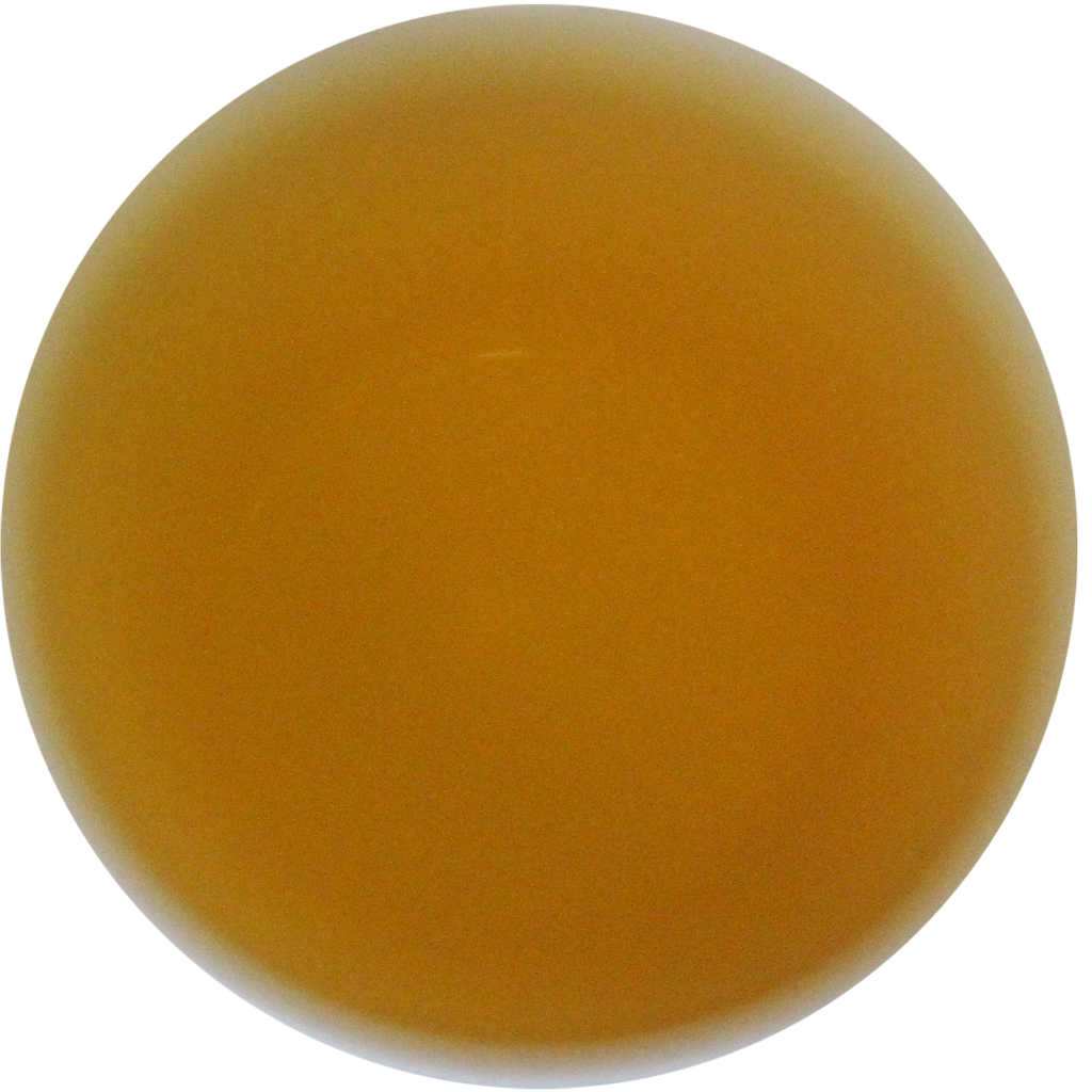 A smooth, round, translucent amber-colored disc or bead on a solid white background.