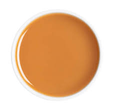 A circular color swatch showing a warm caramel brown color, presented on a clean white background.