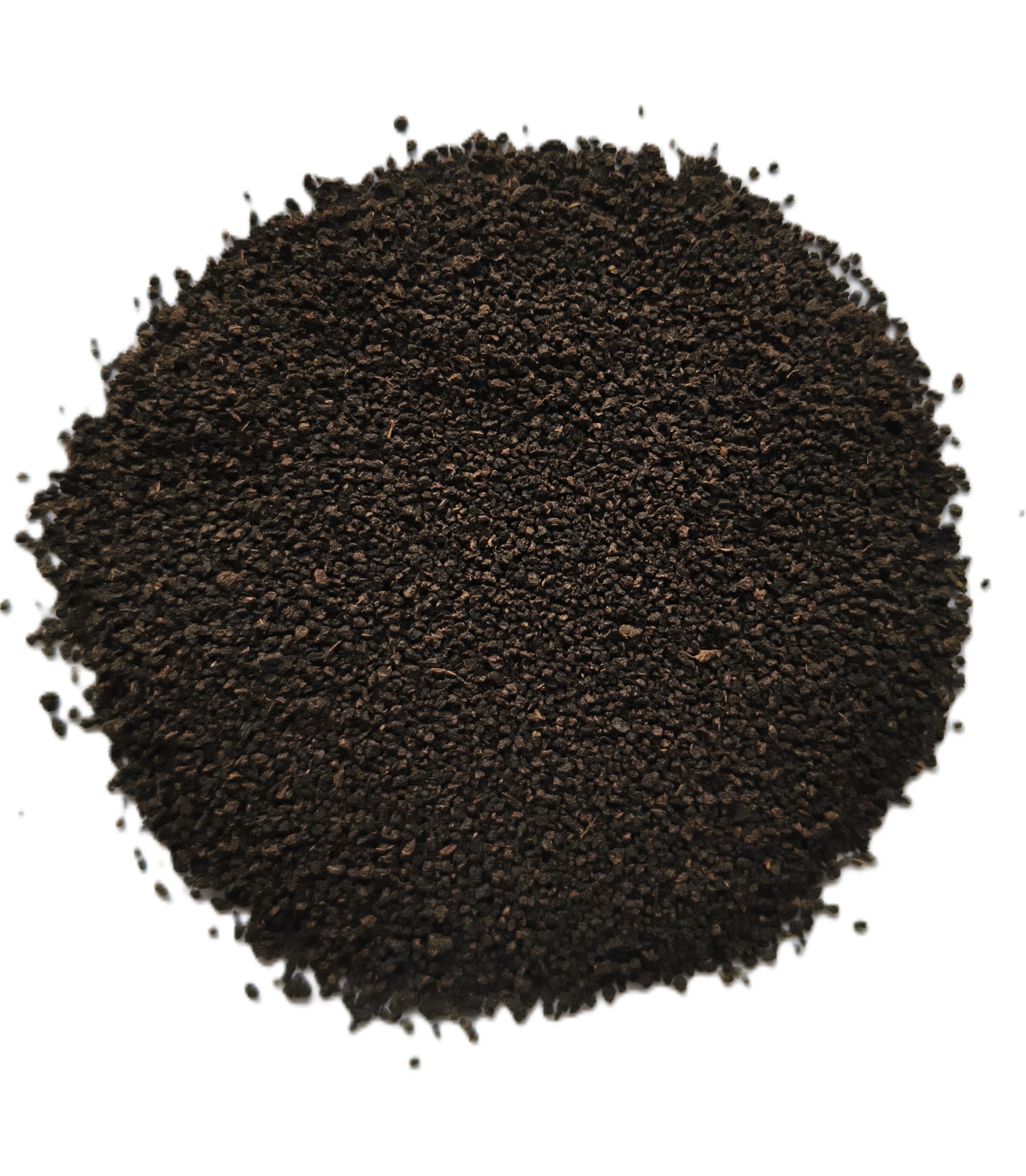 A pile of dark brown to black granular powder or substrate material, photographed from directly above on a plain white background.