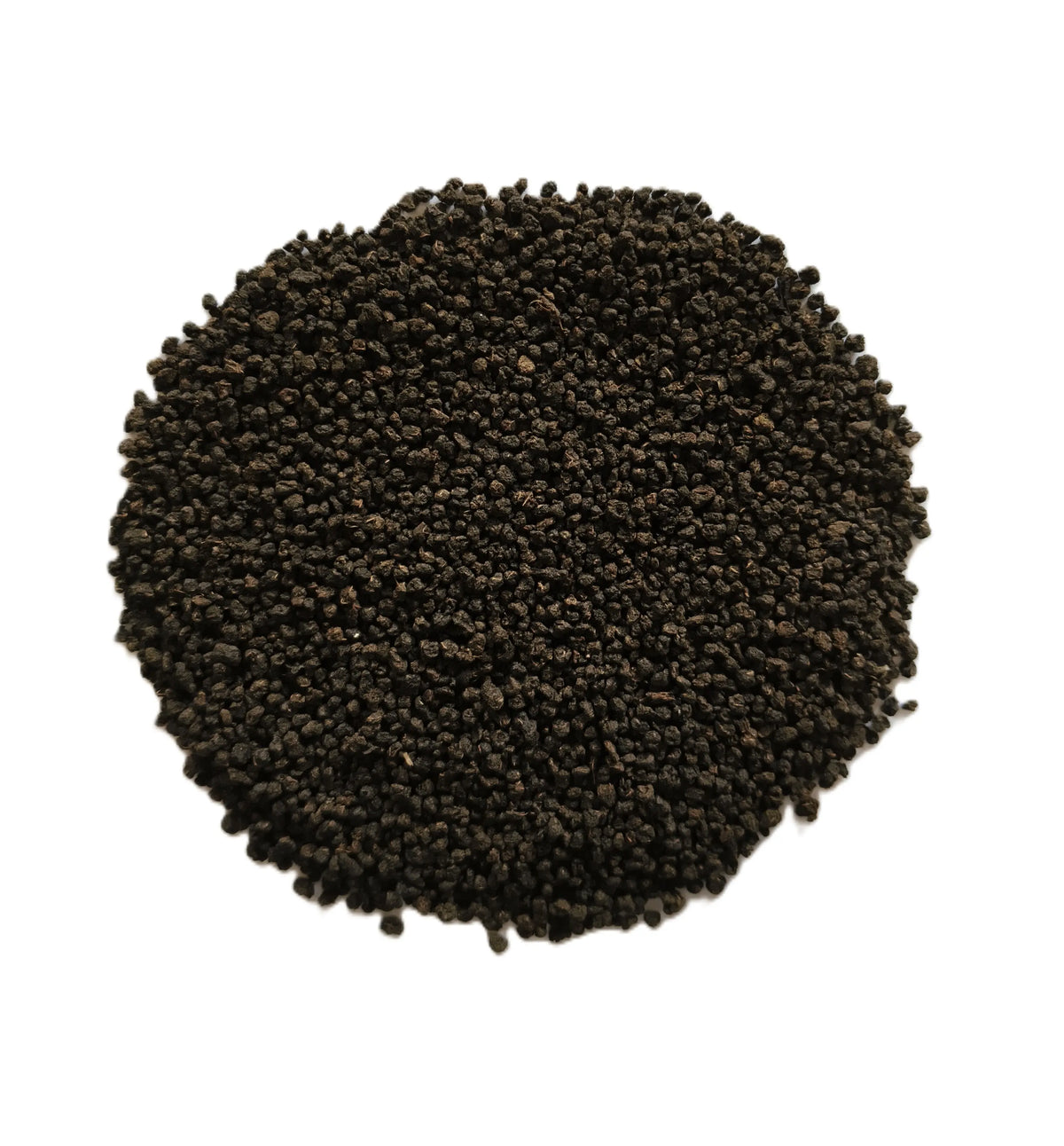A circular pile of small dark brown to black seeds or grains on a plain white background.