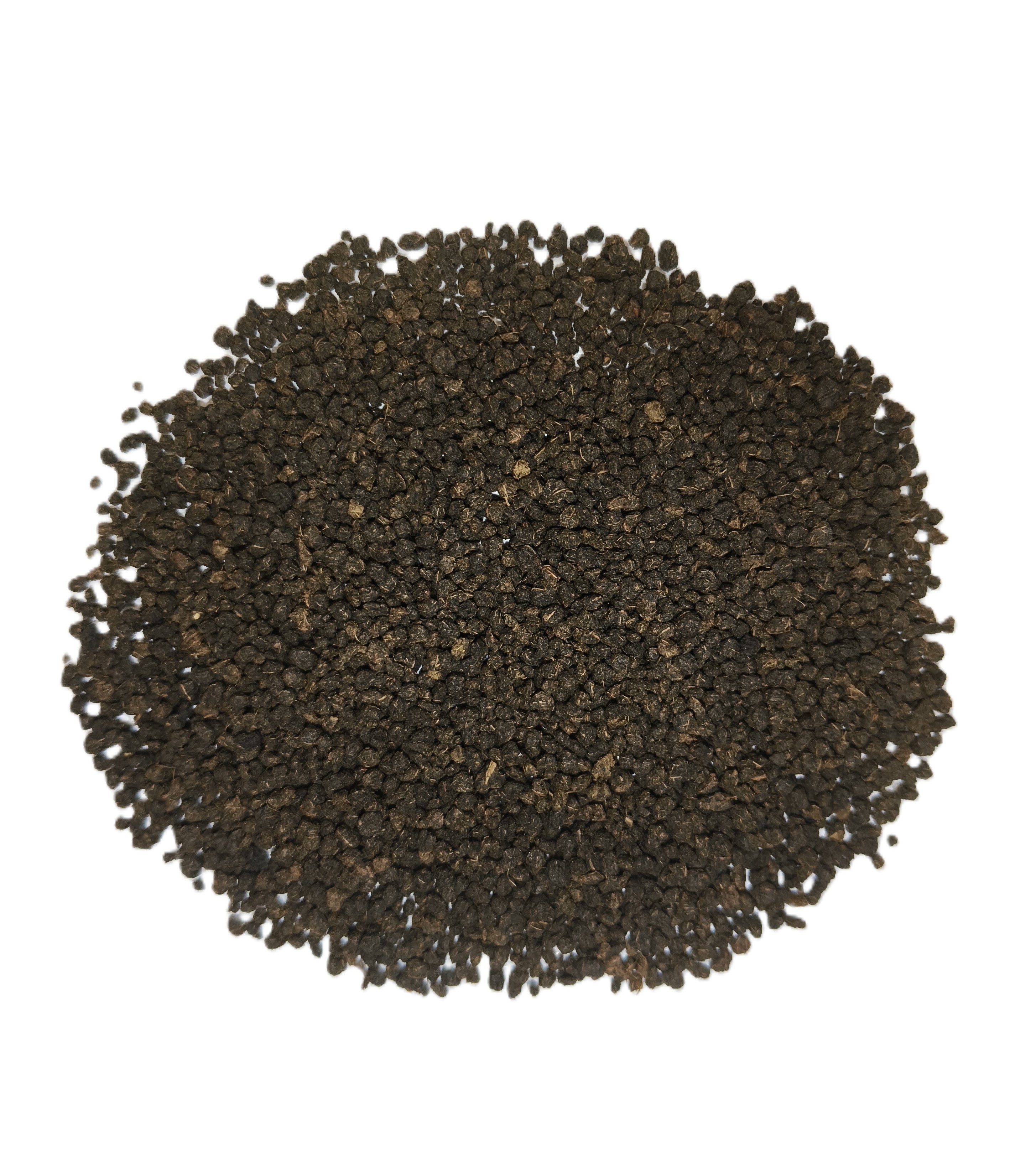 A pile of dark brown to black textured seeds or granules, photographed from directly above on a plain white background.