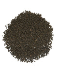 A pile of dark brown to black peppercorns arranged in a circular mound on a plain white background.