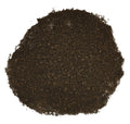 A pile of dark brown loose-leaf tea or herb blend on a plain white background.