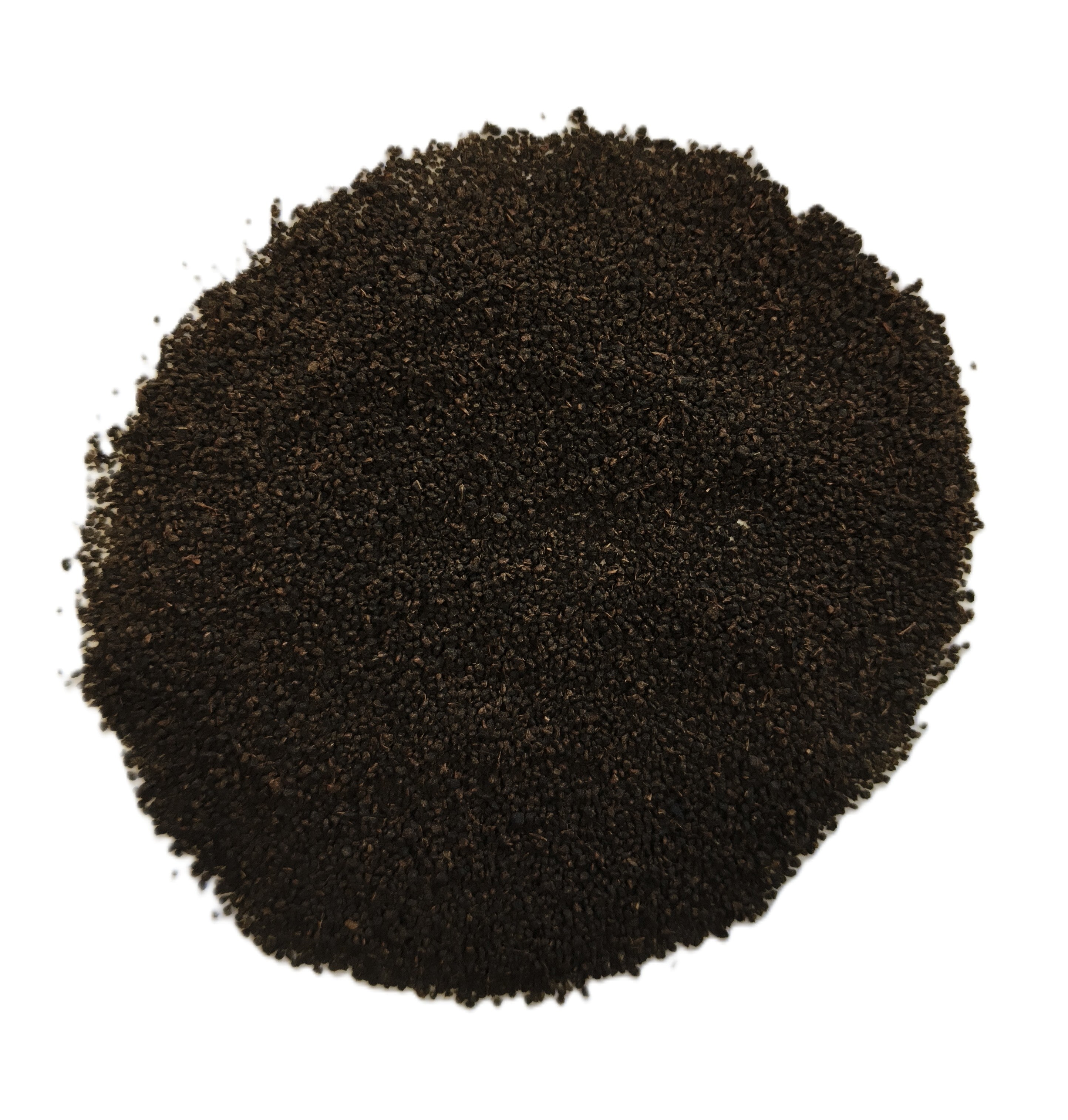 A pile of dark brown to black granular powder or substrate material, photographed from directly above on a plain white background.