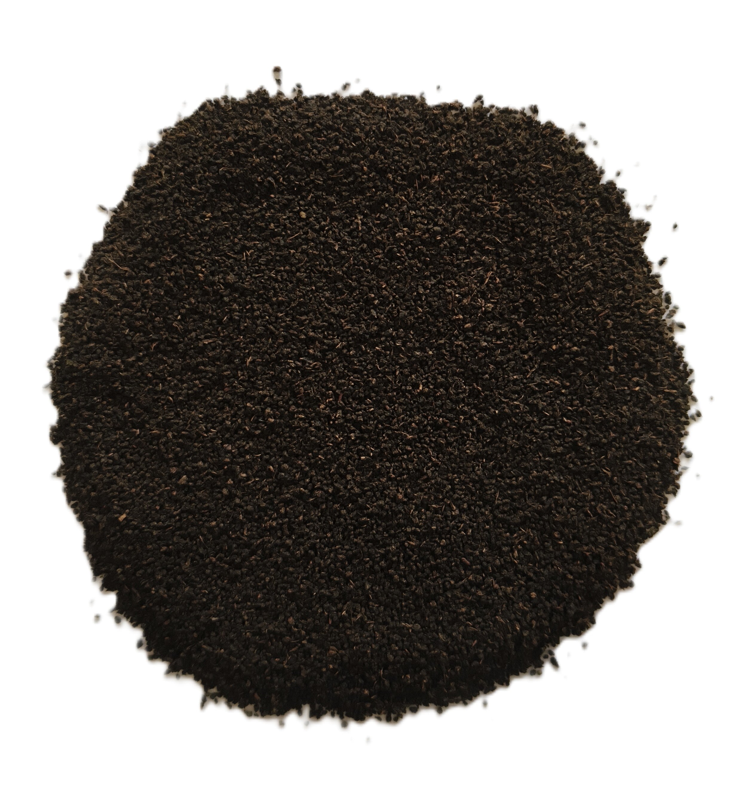 A pile of dark brown to black ground coffee beans or coffee powder, photographed from directly above on a plain white background.
