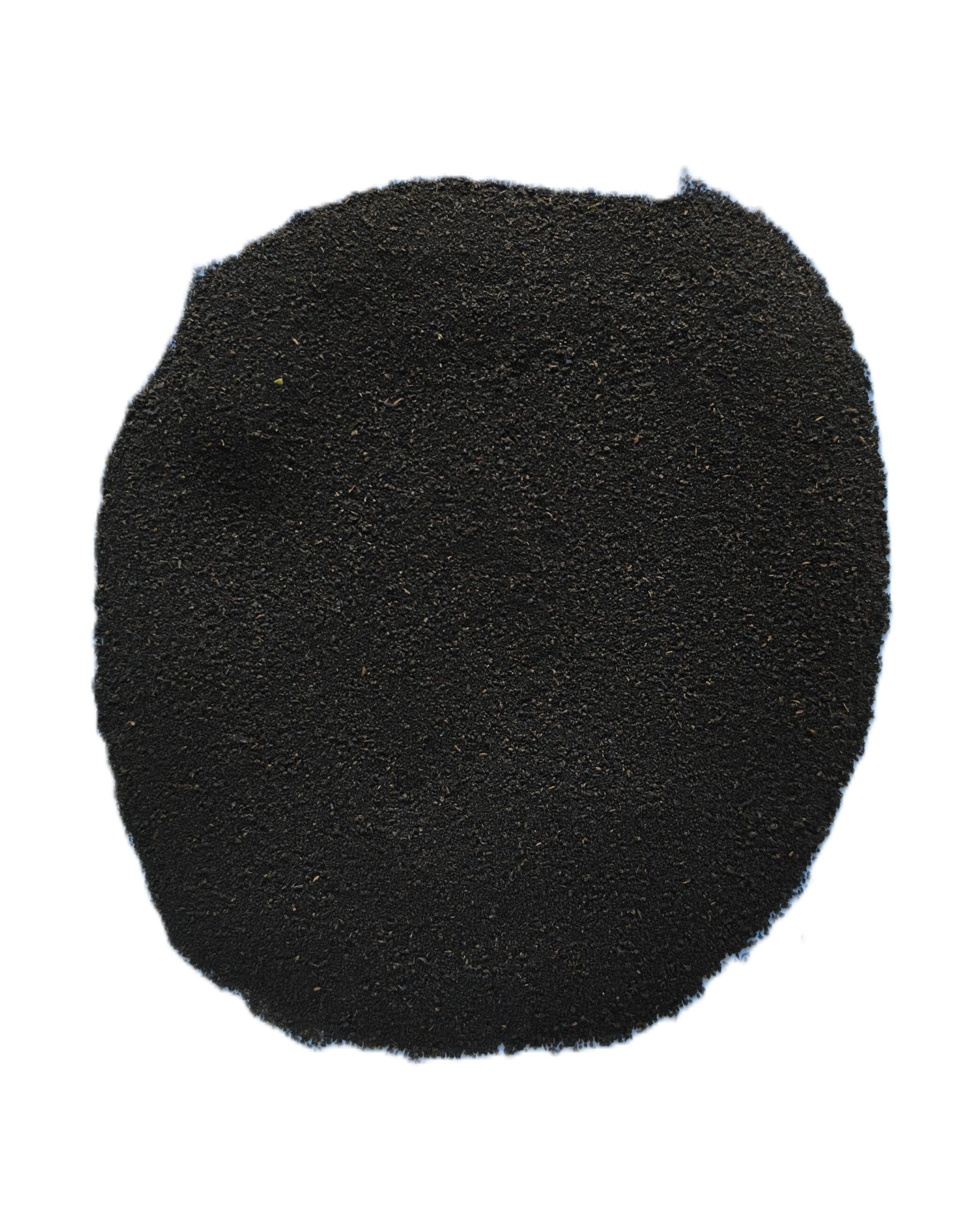 A pile of fine black powder, likely activated charcoal, carbon black, or pigment, photographed on a solid white background.