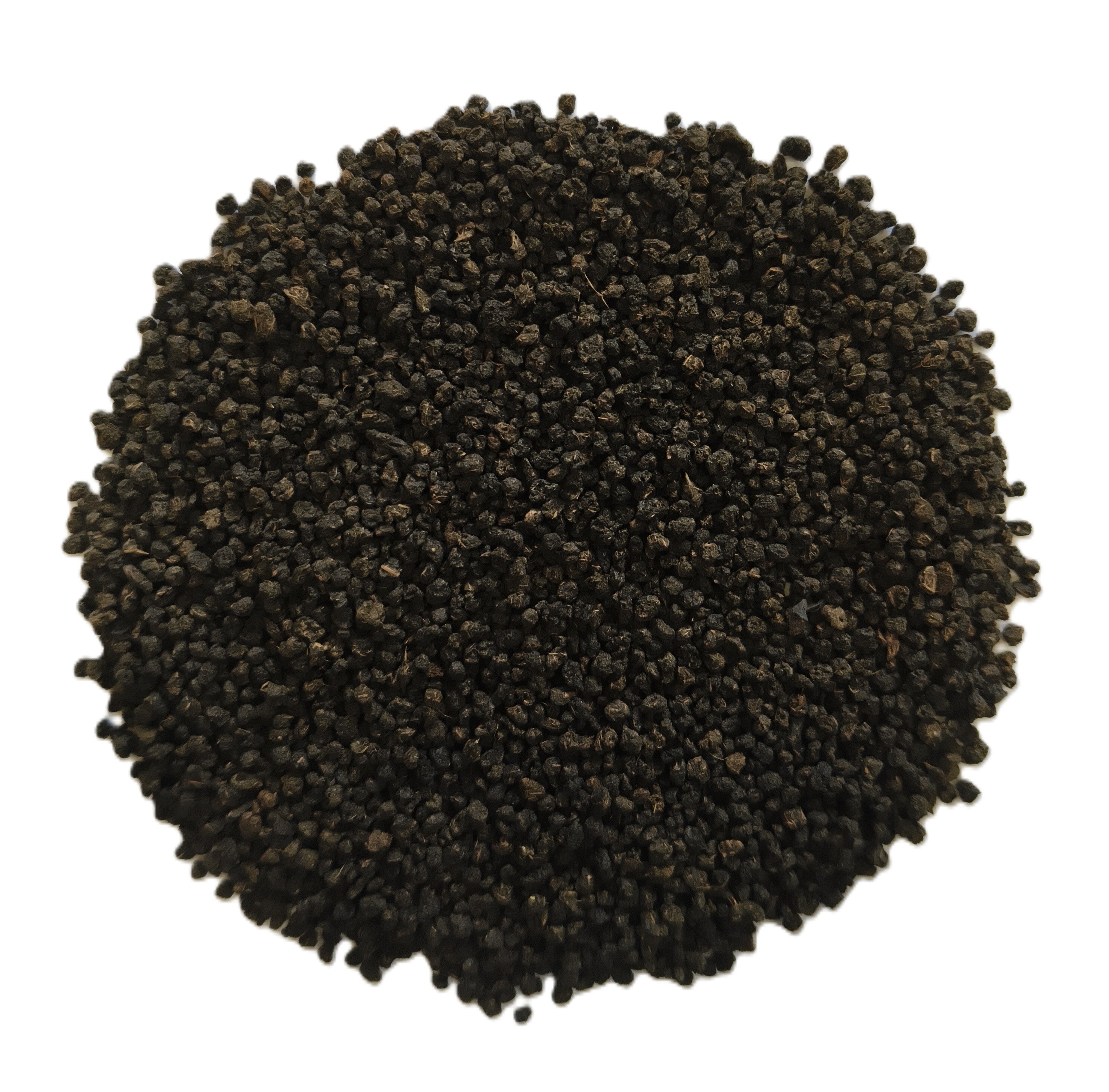 A pile of small dark brown to black seeds or granules photographed from above on a plain white background.